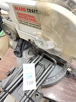 Left side view showing Sears/Craftsman Professional logo, clear blade guard, miter scale and rails