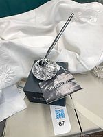 Crystal base with pen on Waterford box and booklet
