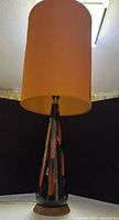 Full view of ceramic lamp with shade