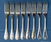 All eight Christofle Perles dinner forks front view