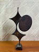 Full view of bronze sculpture front profile