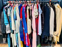 Full rack showing variety of garments and hangers