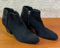 Full view left and right boots, crystal-studded heels visible