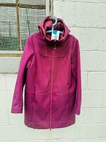 Front view of purple wool parka on hanger