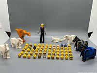 Full lot showing heads grid, horses, Technic figure, shark, blue animal piece