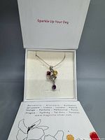 Necklace in open Magnolia box showing pendant and chain