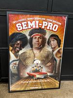 Front view of framed Semi-Pro poster showing artwork and frame