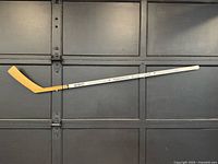 Full left-side view of the CCM hockey stick displaying blade and shaft