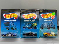 Front view of all three sealed Hot Wheels cars