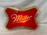 Front view showing Miller logo illuminated