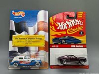 Both Hot Wheels cars in original packaging front view