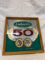 Front view showing mirrored face, graphics and hands