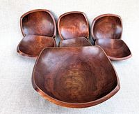 Top view of large bowl with six small bowls surrounding