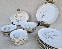 Group shot of plates, bowls and serving dish with Golden Grain pattern