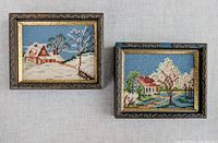 Both framed needlepoint rug hook pictures side by side