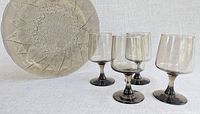 Plate and four goblets grouped to show overall lot
