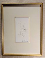 Front view of framed graphite drawing with mat and gold frame