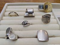All seven sterling silver rings displayed in tray
