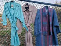 Three jackets hanging: teal London Fog trench, taupe Sequence trench, blue Avoca wool coat
