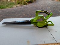 Left side view of full blower showing body, handle and nozzle