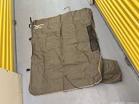 Full view of unfolded seat cover showing color, logo, trim, and overall size