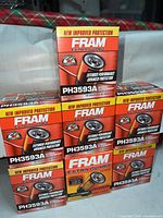 Front view of seven FRAM PH3593A filter boxes stacked