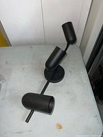 Side profile displaying matte black finish and backplate