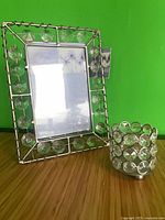 Front view of picture frame and tealight holder showing design and materials