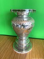 Full view of mercury glass pedestal vase showing overall shape and finish