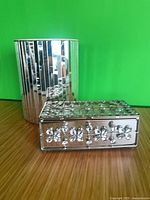 Mirrored waste bin and trinket box together