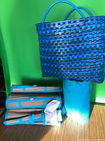 Tote standing upright beside stacked beach mats and rolled mat in bag