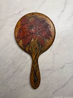 back view showing ostrich leather texture and floral motif