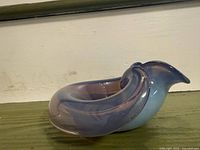 Side view showing spiral shape and blue to purple gradient