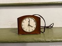 Front view of Westclox brown mantel clock