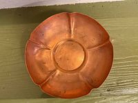 Top view of shallow six-lobed copper bowl