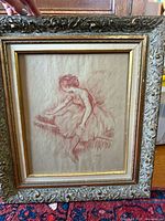 Front view showing ballerina sketch and ornate frame