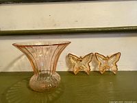 Vase and two butterfly dishes side by side