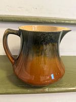 Pitcher right side view showing gradient glaze and handle