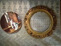 Frame and painted plate side by side