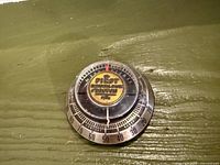 Front view showing full thermometer face with First National Bank of Boston logo and 0–100 scale