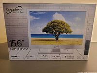 Front of boxed SuperSonic 15.6" FHD LED TV showing model and image