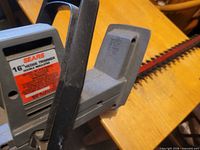 Overall trimmer showing handle, body and blade