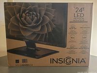 Front of sealed Insignia NS-24EM51A14 monitor box