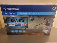 Front of boxed Westinghouse 24-inch Smart LED HDTV