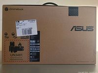 Front of sealed Asus Chromebook C425TA box showing logo, UN3481 battery label and handle