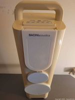 Front view of Bacini Acoustica speaker tower showing two speakers and branding