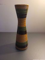 Full view of tall banded ceramic vase