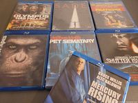 Front view of seven Blu-ray movie cases