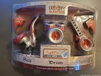 Front of sealed package showing three instrument speakers