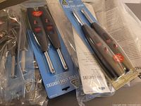 Front view showing multiple sealed two-pack stove lighter packages